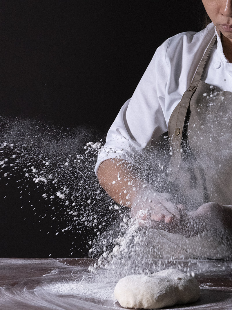 queenie lau is splashing flour at bread secret baking workshop