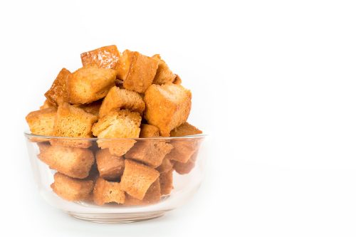 A bowl of bread secret honey butter croutons
