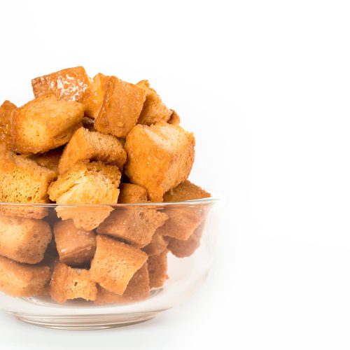 A bowl of bread secret honey butter croutons