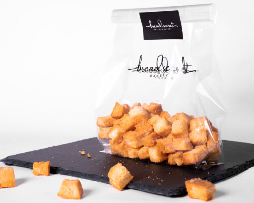 A bowl of A bag of bread secret honey butter croutons