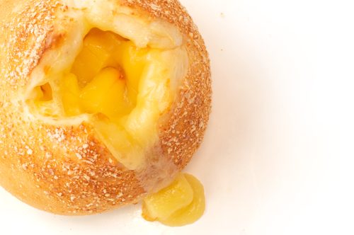 bread secret melted cheese flowing out of the four-cheese bun