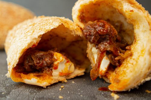 bread secret breaking a cream cheese mala chicken bun