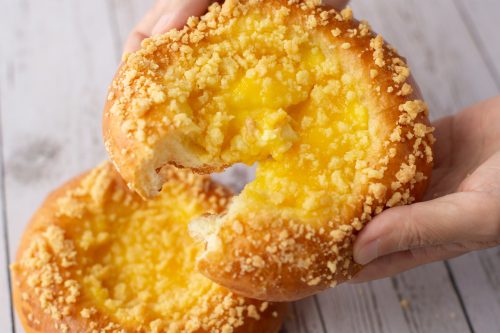 bread-secret-hand-splitting-a-lemon-crumble-bread bread secret hand splitting a lemon crumble bread