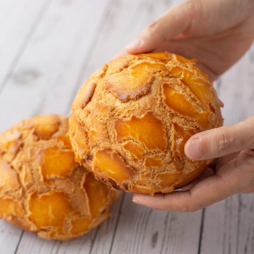 bread secret holding a japanese bo lo bun with butter