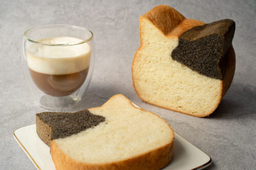 bread-secret-sliced-neko-neko-shokupan-with-coffee-on-concrete-table-closeup