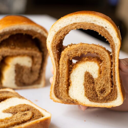 bread-secret-holding-a-slice-of-coffee-swirl-loaf