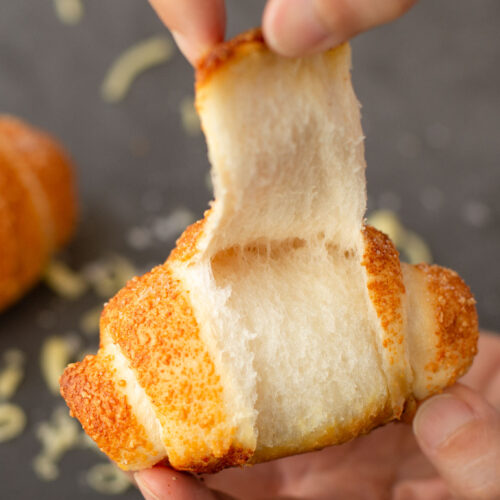 bread-secret-tearing-a-cheesy-salted-butter-roll